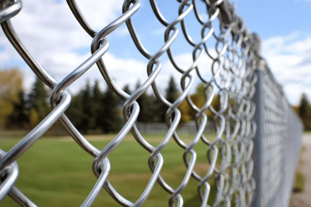 A close up of a chain link fence